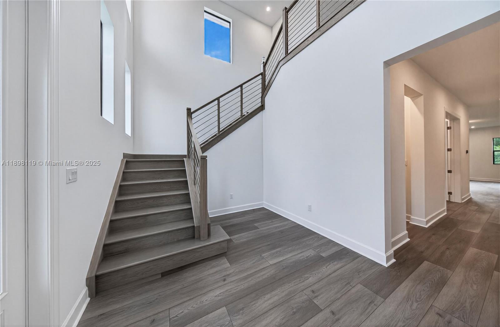 2722 Northwest 87th Terrace Cooper City, FL 33024 - Photo 10 of 44 a view of entryway and hall with wooden floor