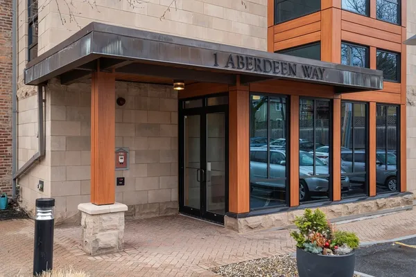 a front view of a building with an outdoor seating