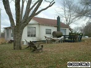 7132 Lingerfelt Road Vale, NC 28168 - Photo 8 of 8 a backyard of a house with table and chairs