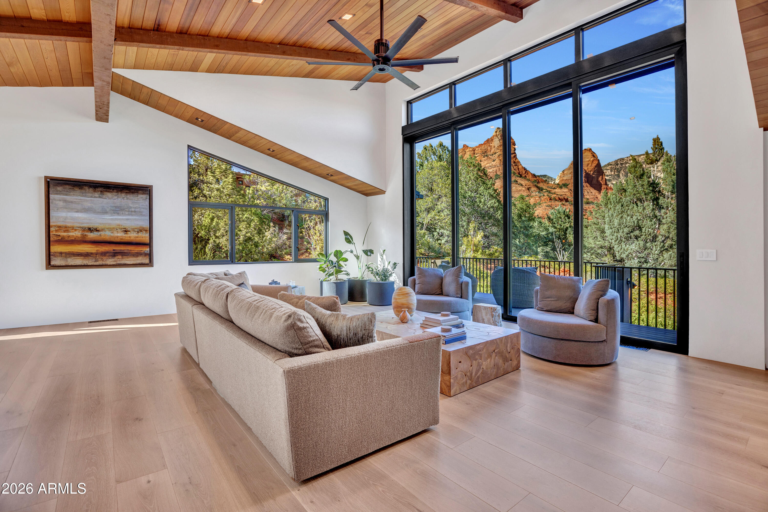 180 Rim Shadows Drive Sedona, AZ 86336 - Photo 12 of 72 a living room with furniture and a large window