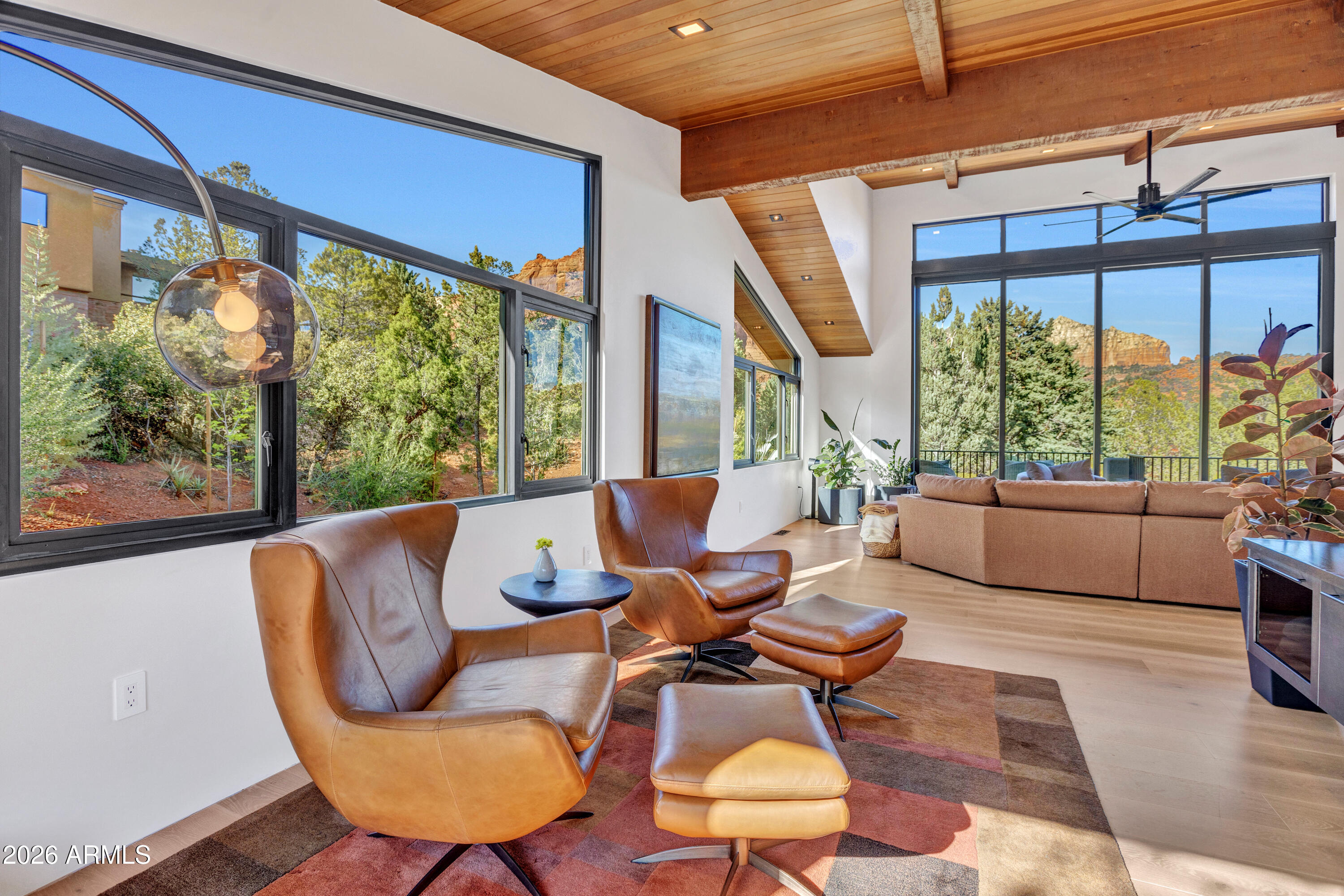 180 Rim Shadows Drive Sedona, AZ 86336 - Photo 17 of 72 a living room with furniture and a large window