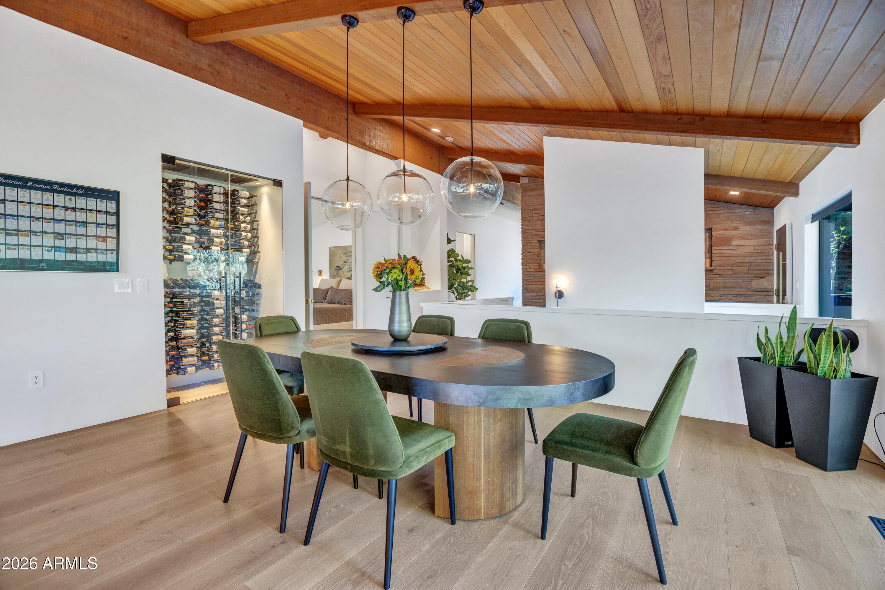 180 Rim Shadows Drive Sedona, AZ 86336 - Photo 23 of 72 a view of a dining room with furniture window and wooden floor