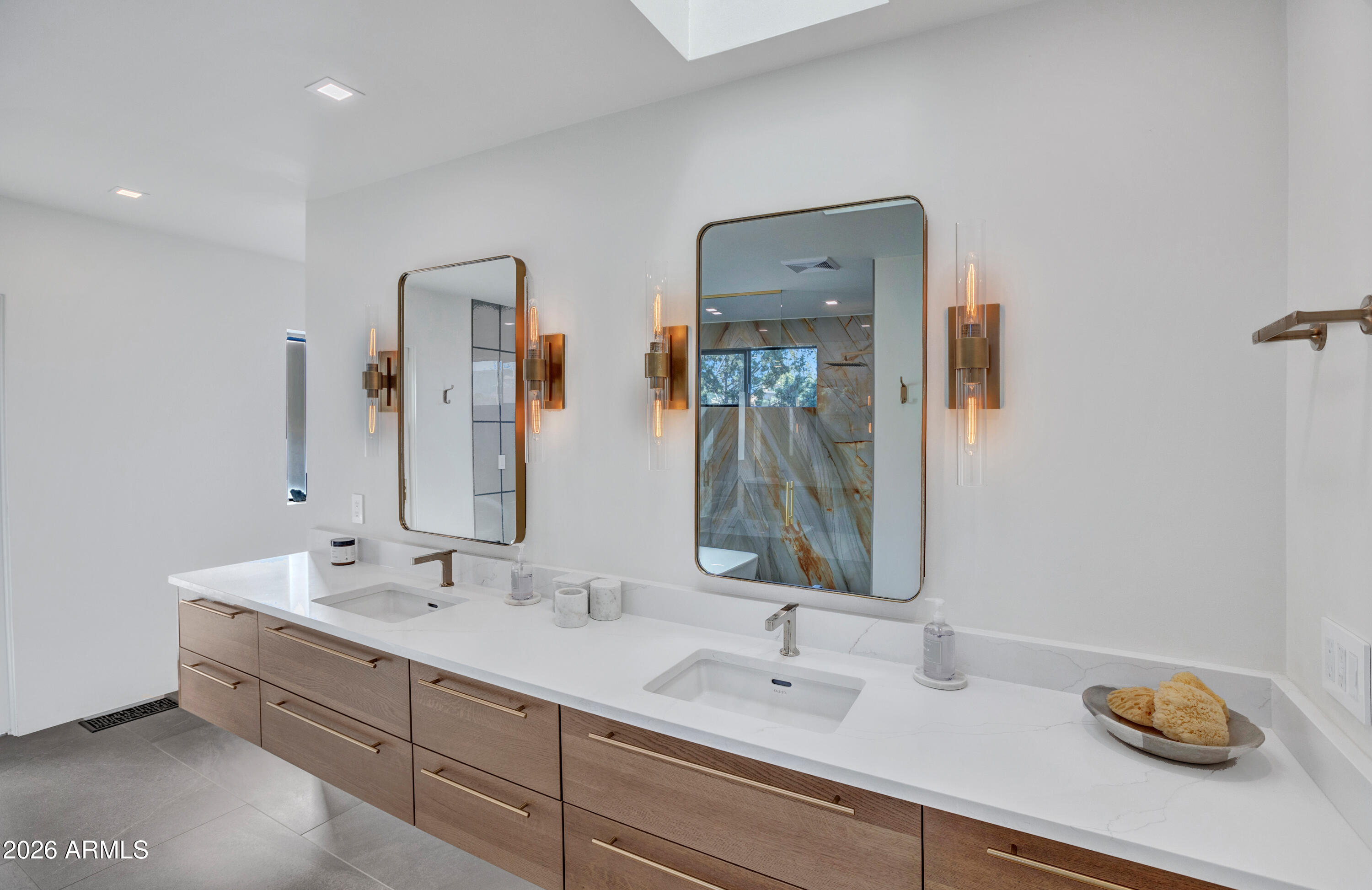180 Rim Shadows Drive Sedona, AZ 86336 - Photo 28 of 72 a bathroom with a double vanity sink and a mirror