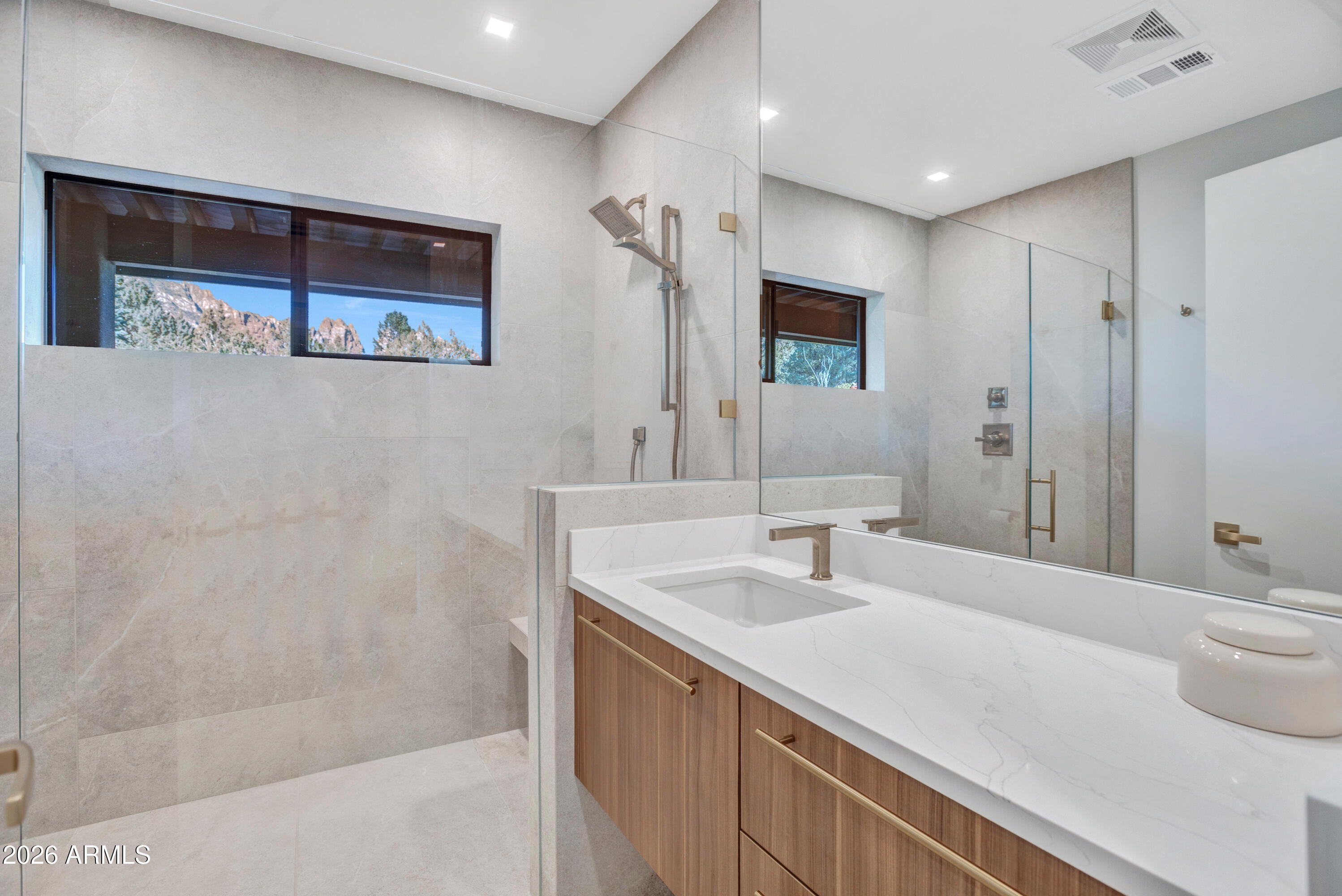 180 Rim Shadows Drive Sedona, AZ 86336 - Photo 41 of 72 a bathroom with a sink and a mirror