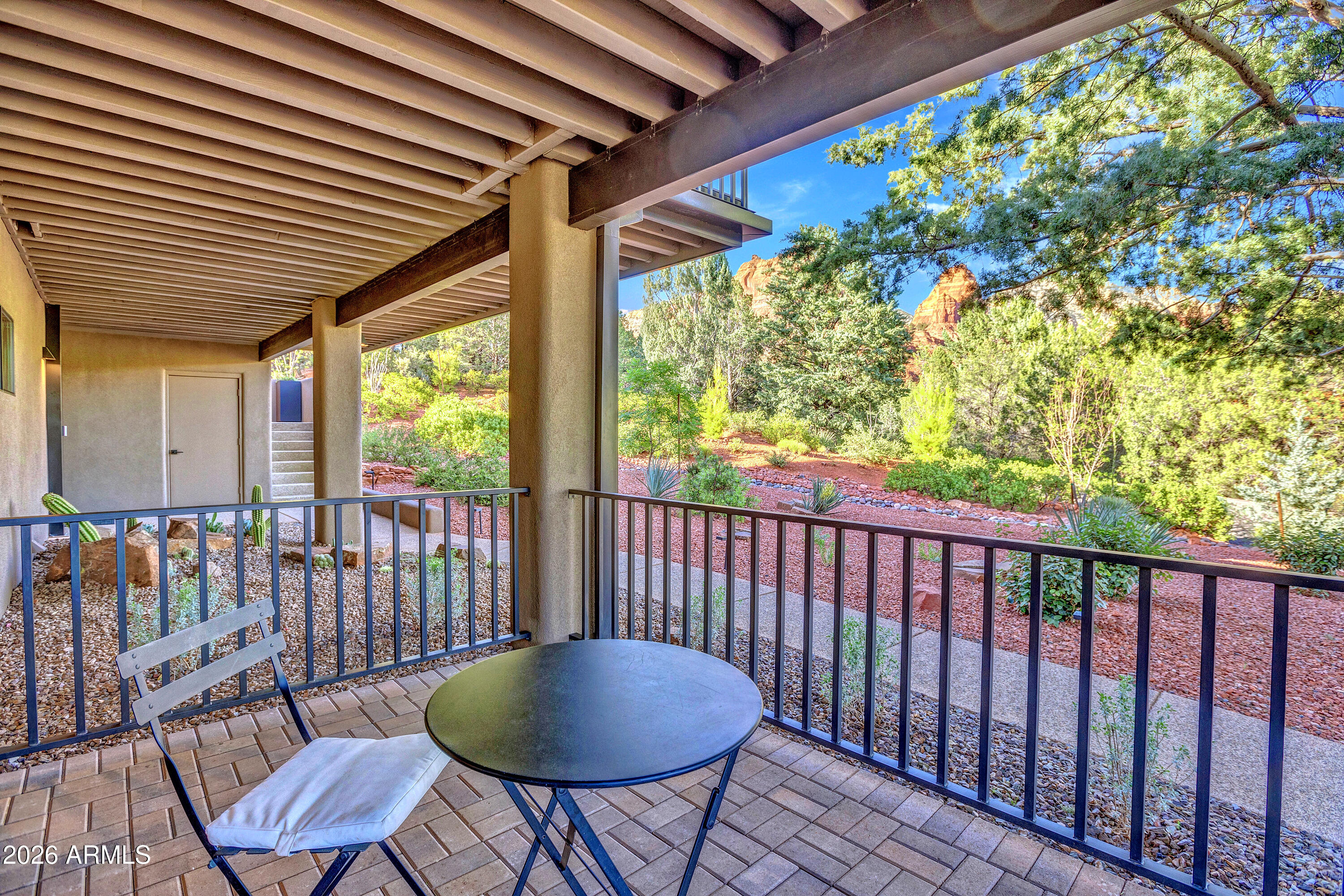 180 Rim Shadows Drive Sedona, AZ 86336 - Photo 42 of 72 a view of a two chairs in the balcony