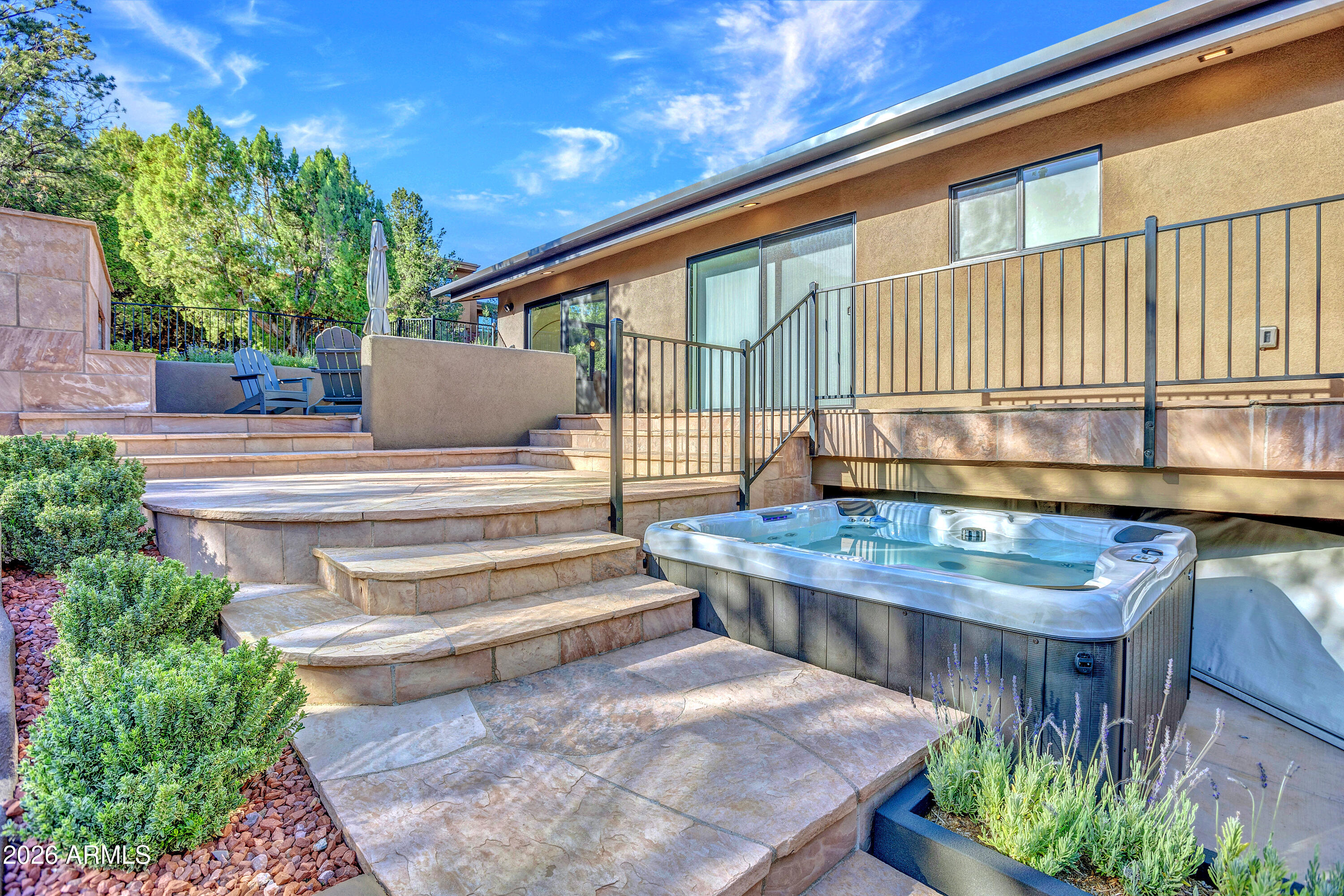 180 Rim Shadows Drive Sedona, AZ 86336 - Photo 49 of 72 a view of a backyard with sitting area