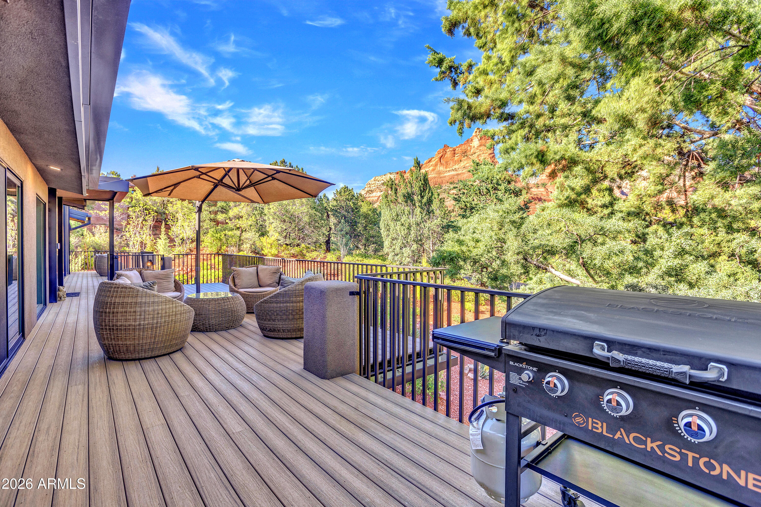 180 Rim Shadows Drive Sedona, AZ 86336 - Photo 60 of 72 a view of a chairs and table on the wooden floor