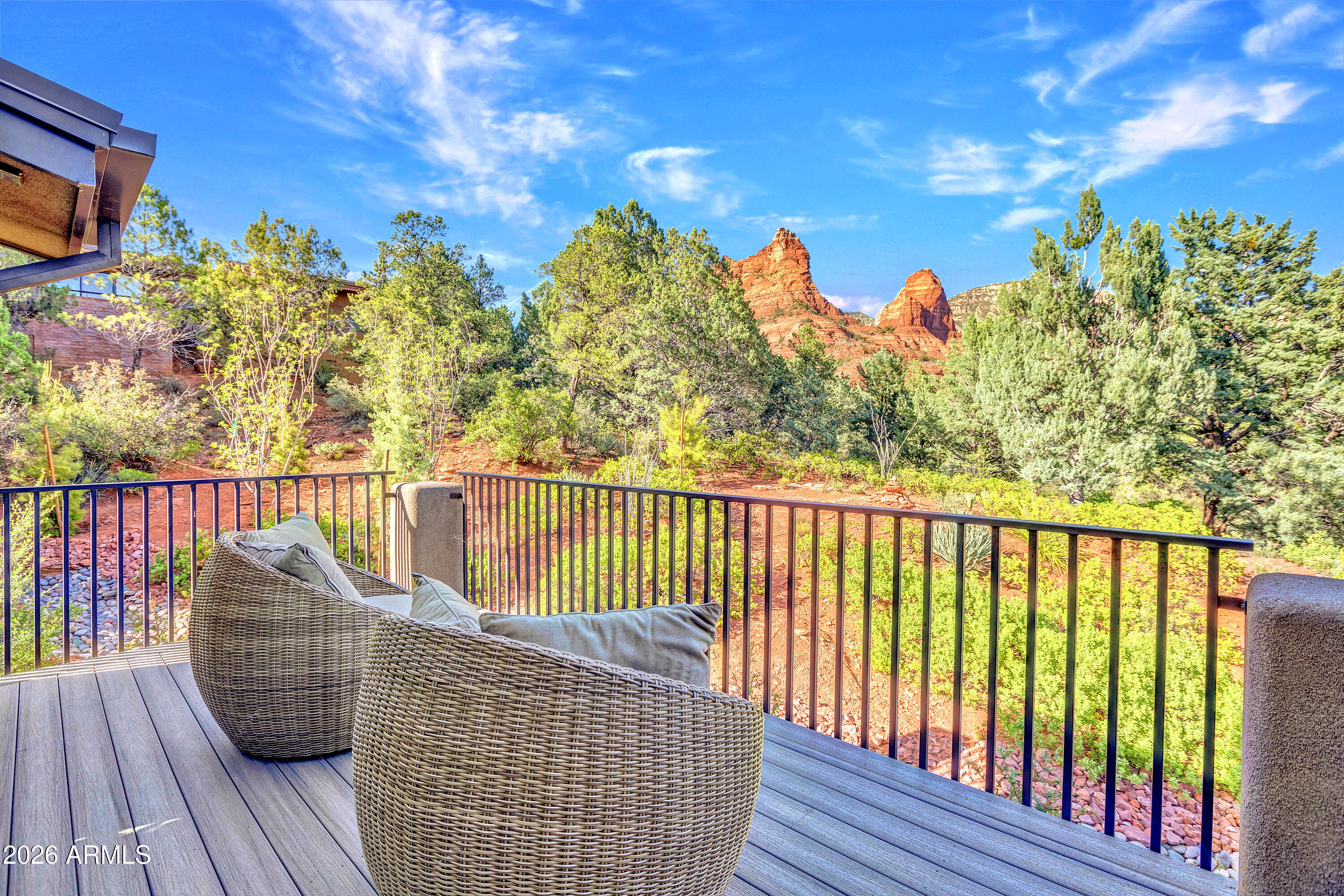 180 Rim Shadows Drive Sedona, AZ 86336 - Photo 6 of 72 a balcony with wooden floor and fence