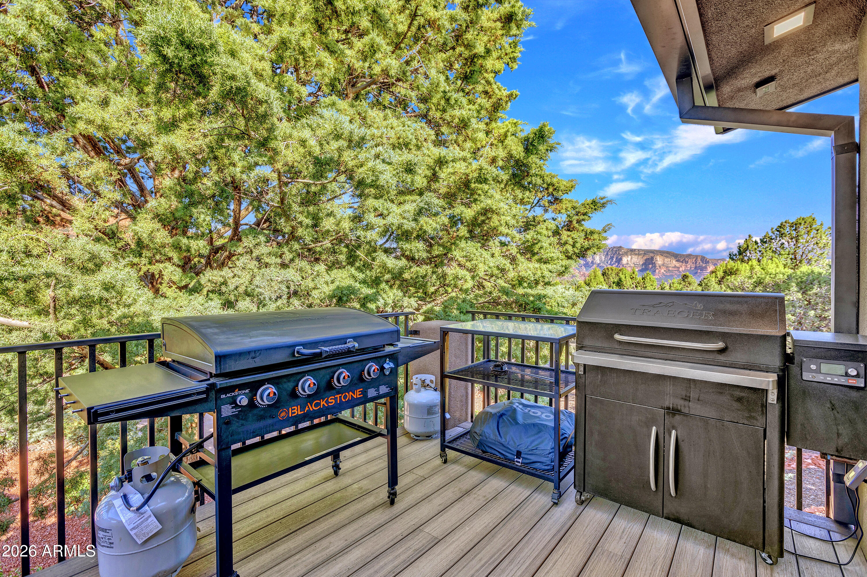 180 Rim Shadows Drive Sedona, AZ 86336 - Photo 61 of 72 a view of a balcony with chairs
