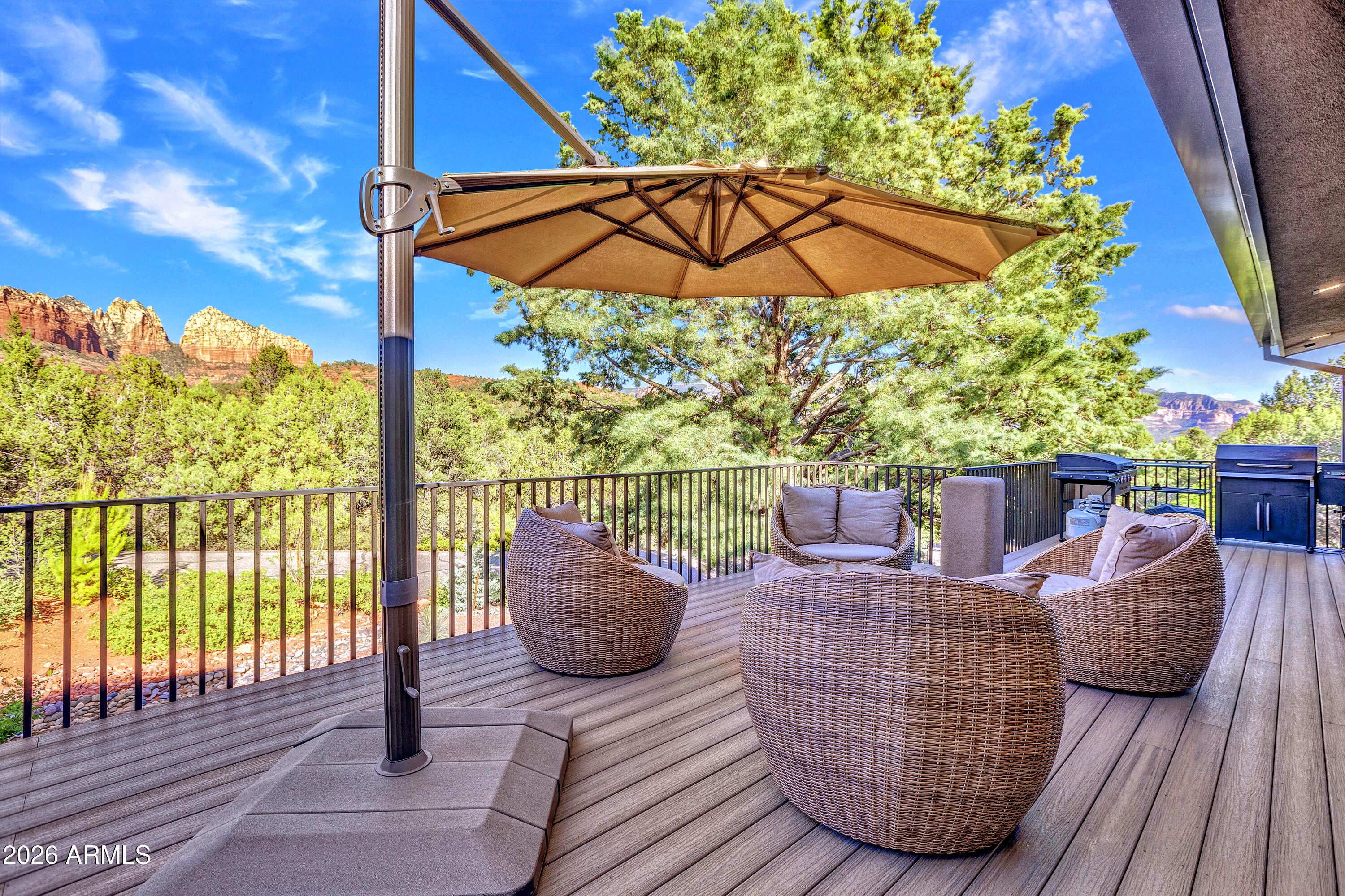 180 Rim Shadows Drive Sedona, AZ 86336 - Photo 63 of 72 a view of balcony with furniture and umbrella