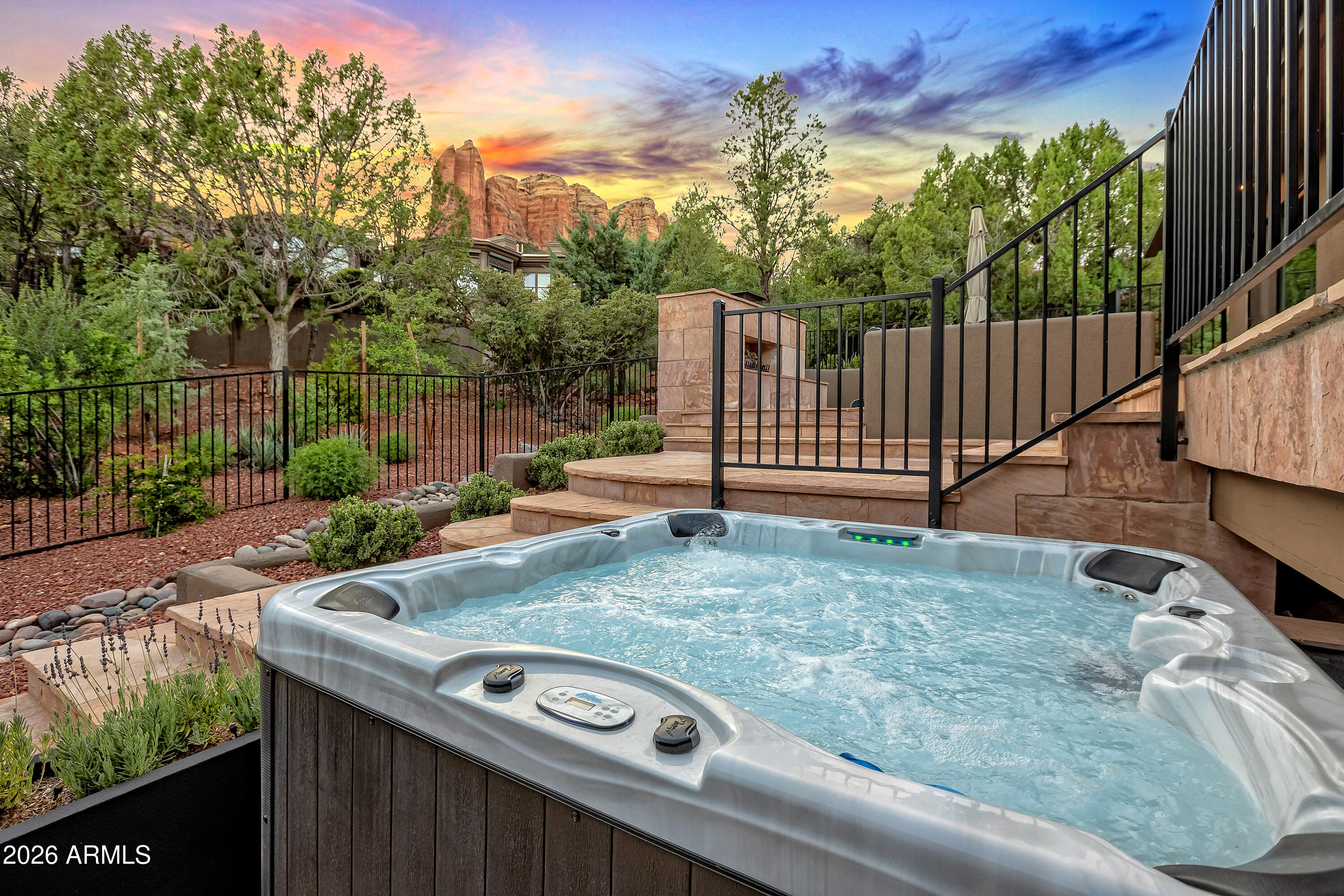 180 Rim Shadows Drive Sedona, AZ 86336 - Photo 7 of 72 a view of a backyard with iron fence