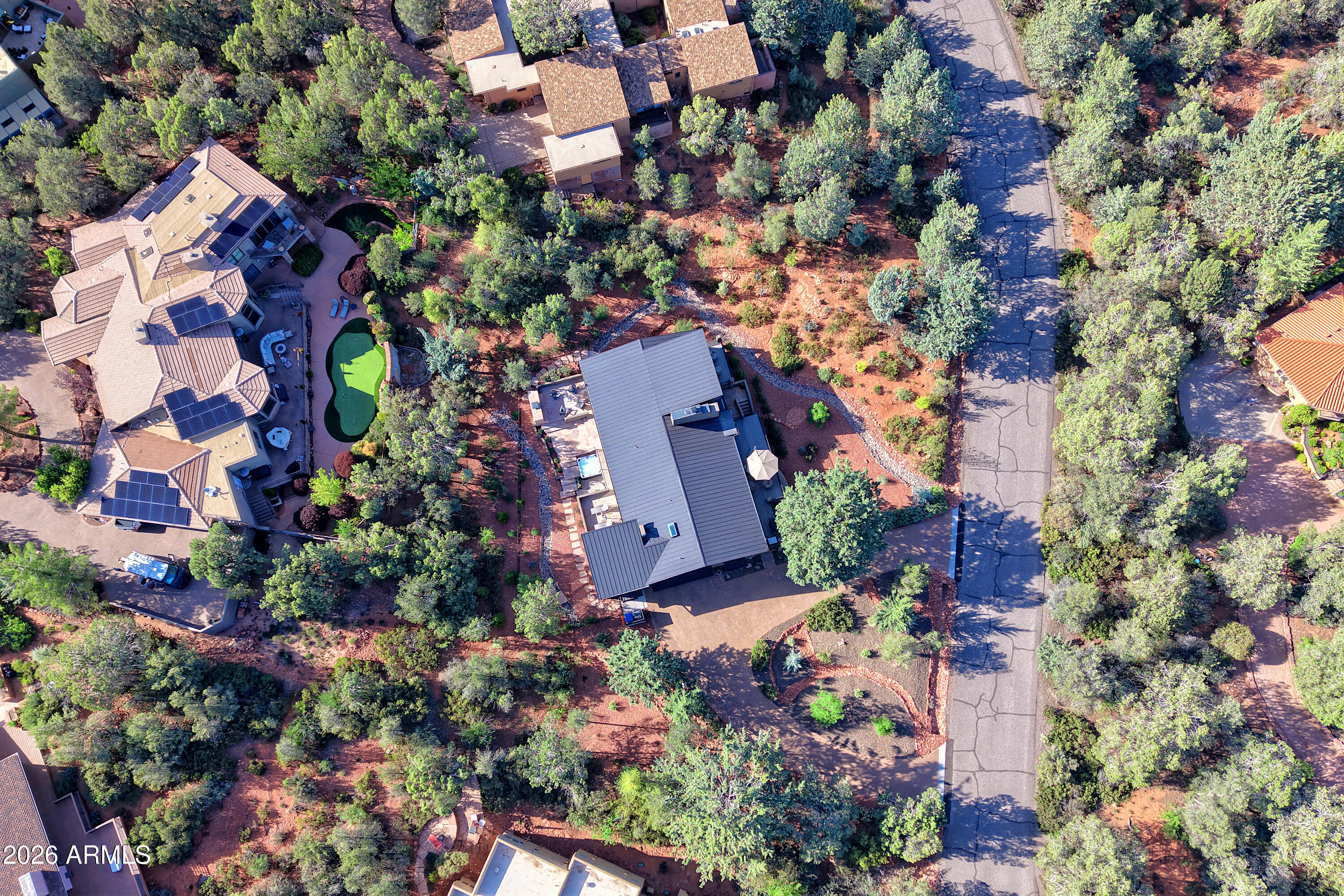 180 Rim Shadows Drive Sedona, AZ 86336 - Photo 71 of 72 an aerial view of a house with a yard and garden view