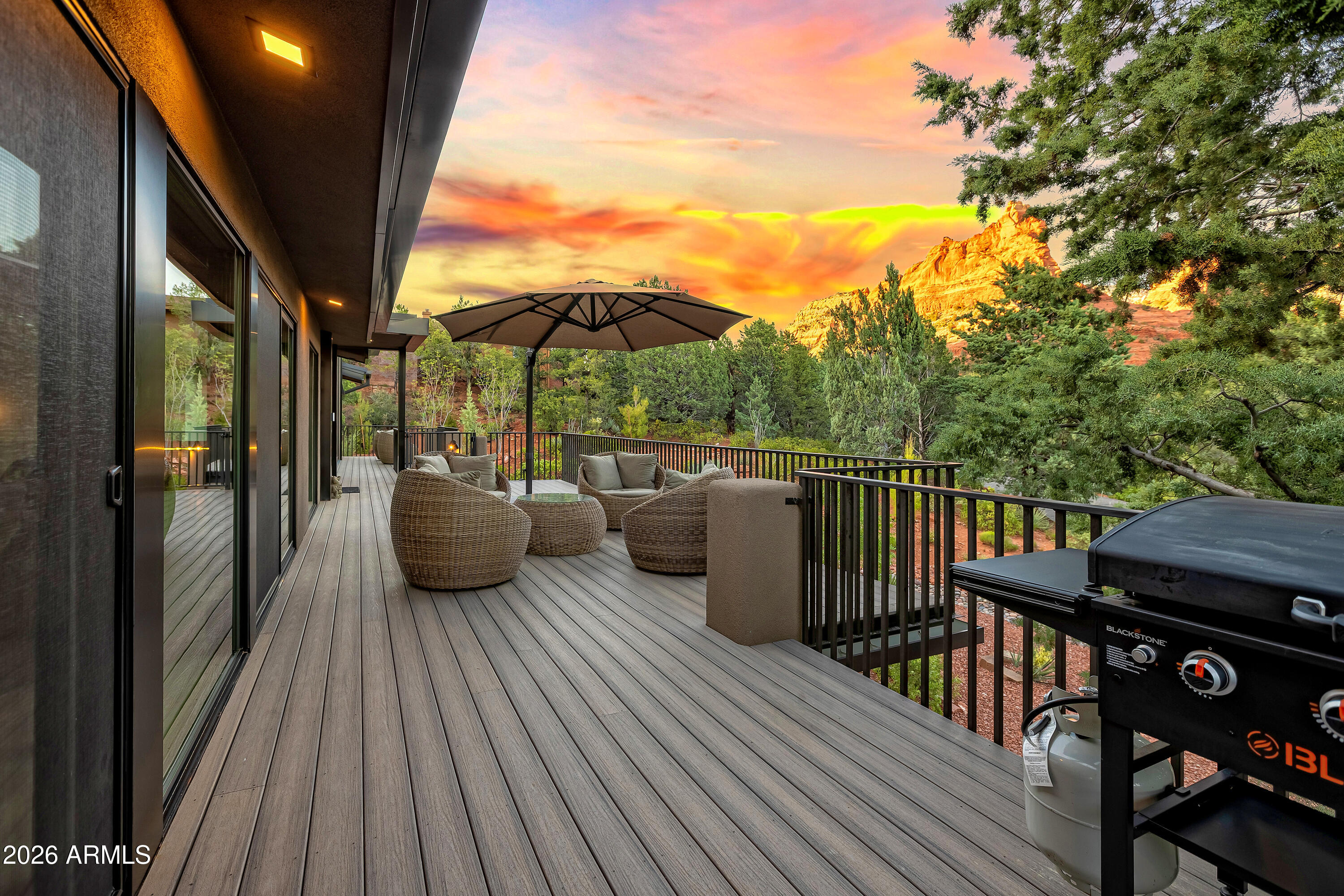 180 Rim Shadows Drive Sedona, AZ 86336 - Photo 8 of 72 a view of a balcony with furniture