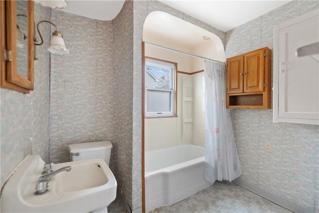 520 Center Street Rochester, PA 15074 - Photo 21 of 24 a bathroom with a sink a toilet and shower