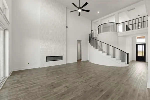 a view of an entryway with wooden floor