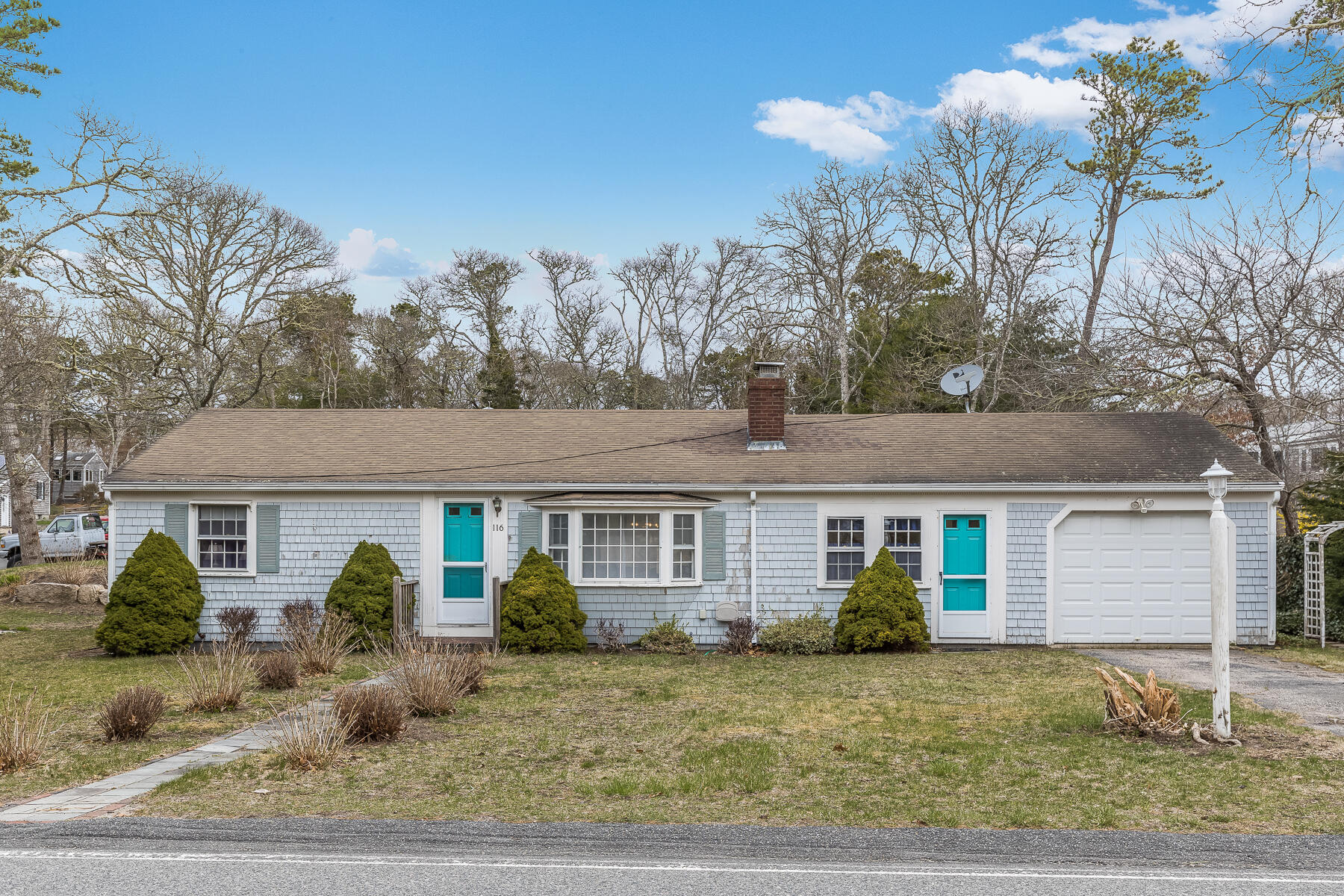 a front view of a house with garden