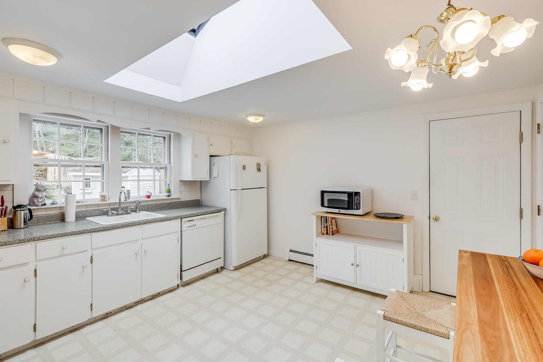 116 Long Road Harwich, MA 02645 - Photo 12 of 32 a kitchen with white cabinets and sink