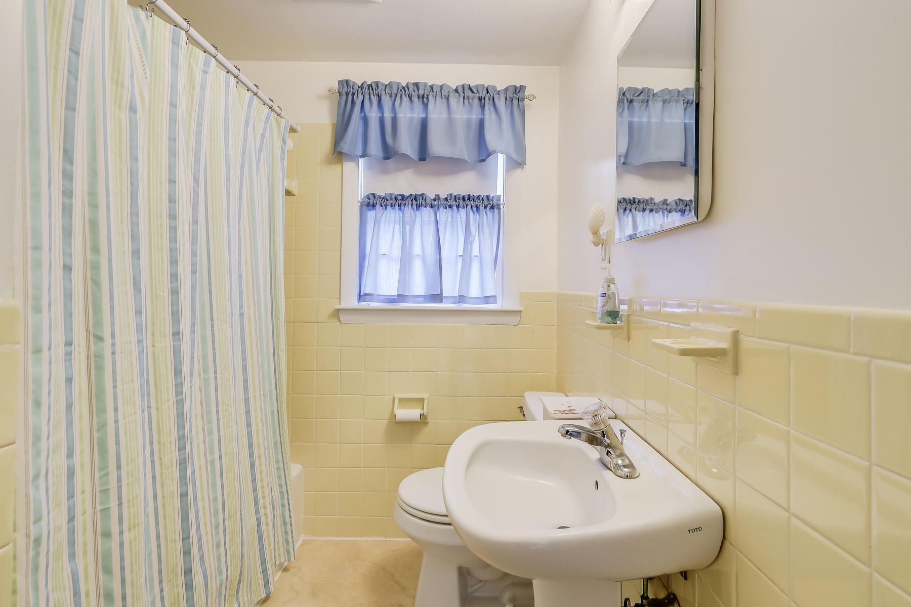 116 Long Road Harwich, MA 02645 - Photo 17 of 32 a bathroom with a sink a toilet and a mirror