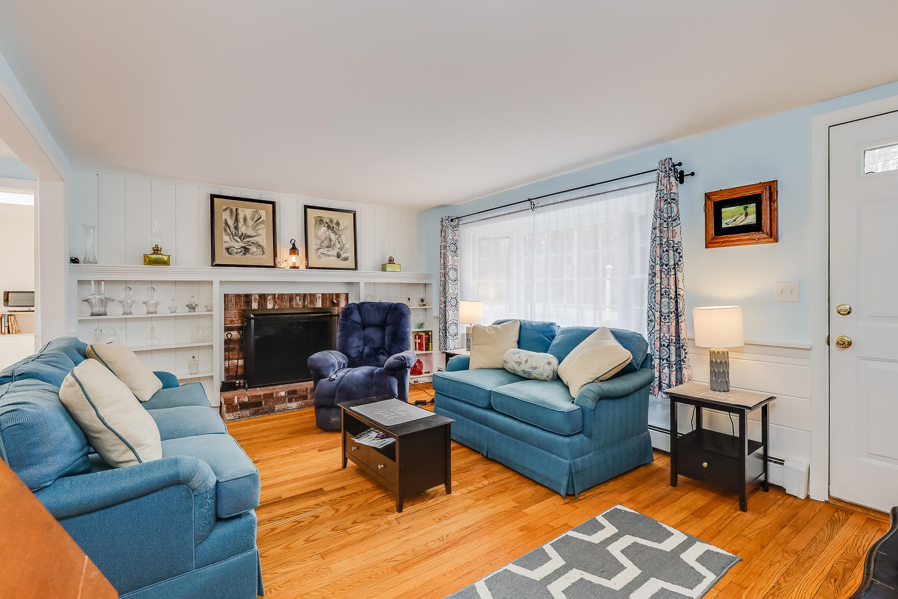 116 Long Road Harwich, MA 02645 - Photo 6 of 32 a living room with furniture and a fireplace