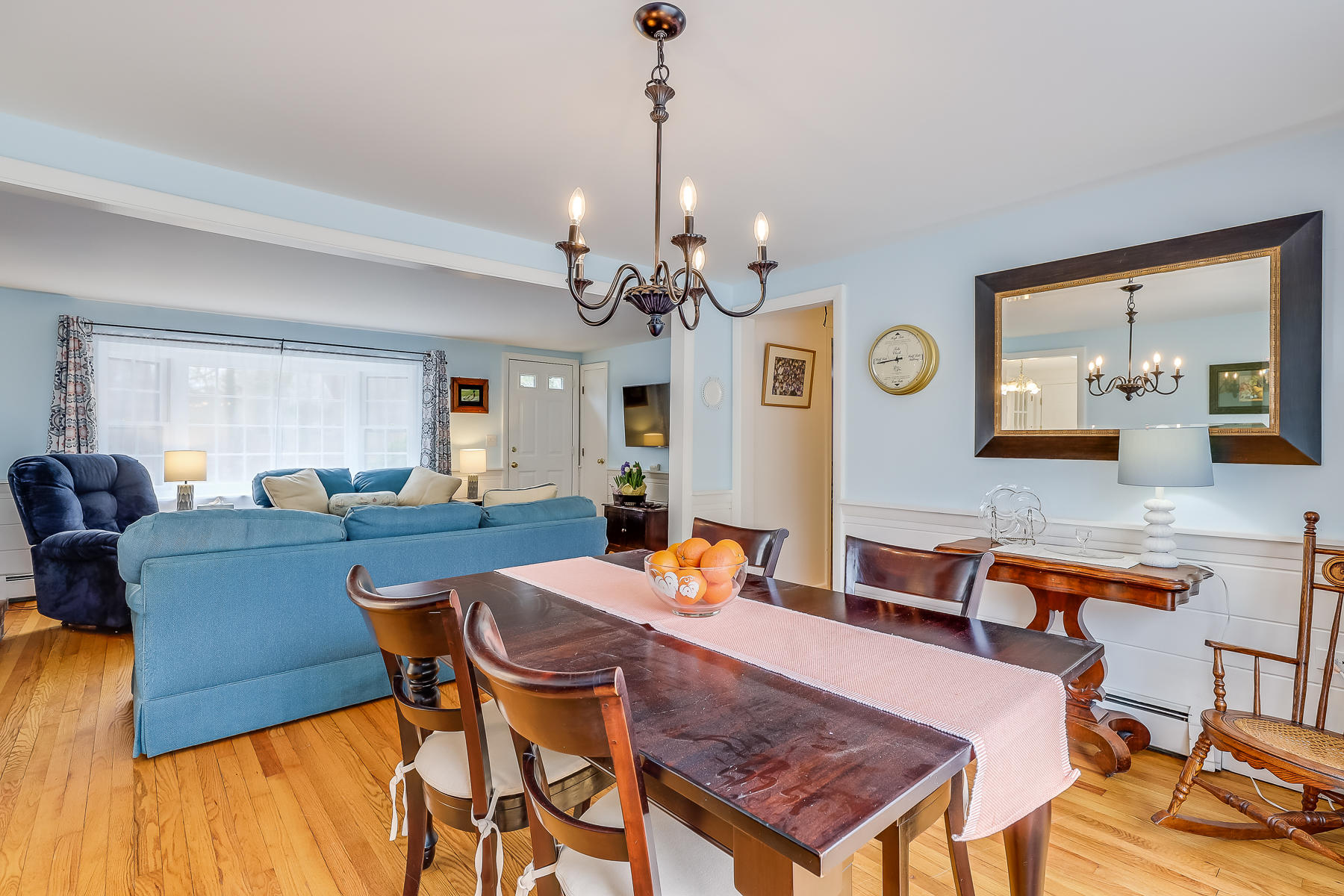 116 Long Road Harwich, MA 02645 - Photo 9 of 32 a view of a dining room with furniture and a chandelier