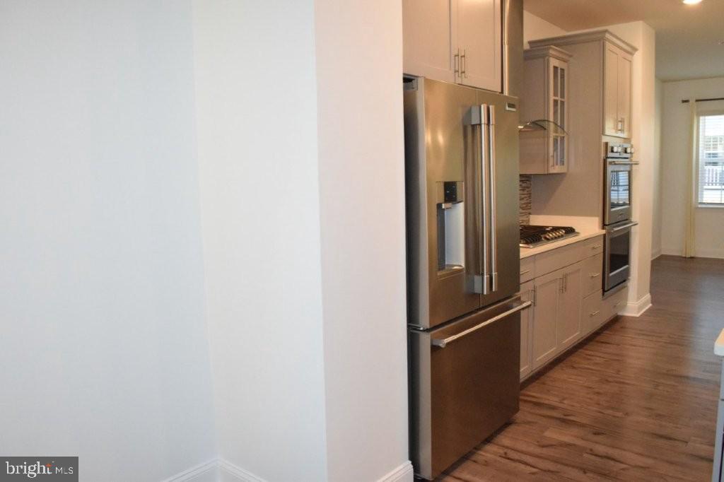 7505 Ledgers Way Hanover, MD 21076 - Photo 15 of 50 a kitchen with stainless steel appliances a refrigerator and cabinets