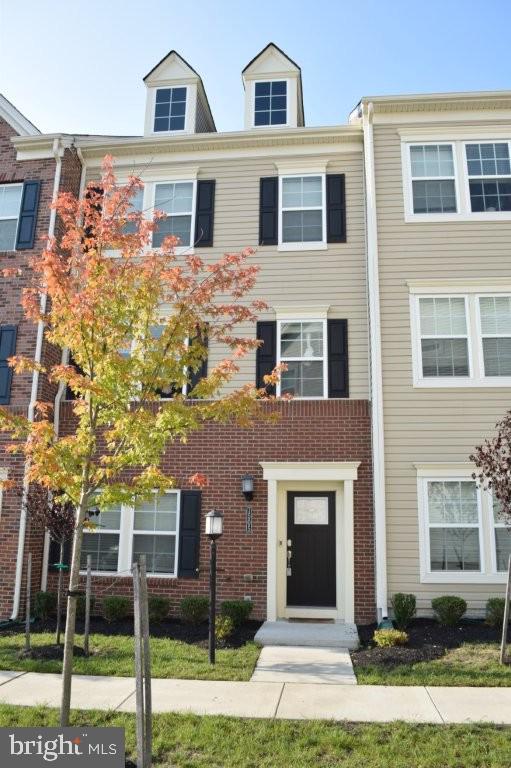 7505 Ledgers Way Hanover, MD 21076 - Photo 2 of 50 a front view of a building with garden