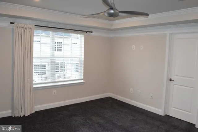 a view of an empty room and closet area