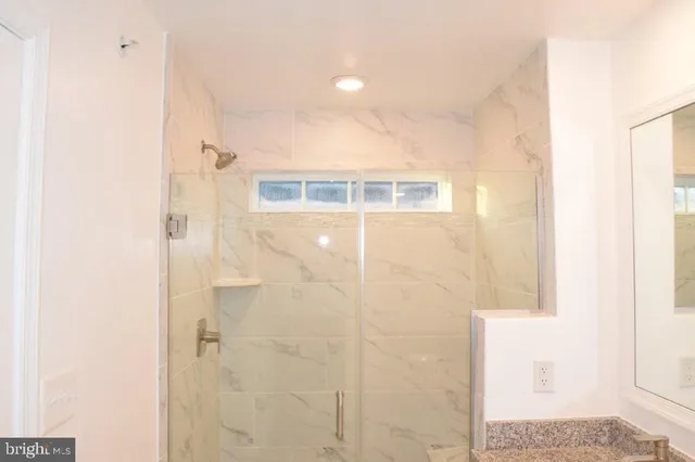 a bathroom with a sink and a shower