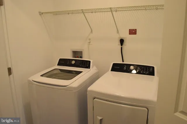a bathroom with a shower and a glass door