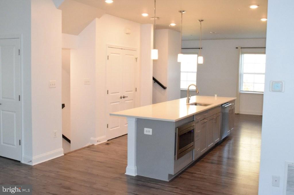 7505 Ledgers Way Hanover, MD 21076 - Photo 10 of 50 a kitchen with a sink and a mirror
