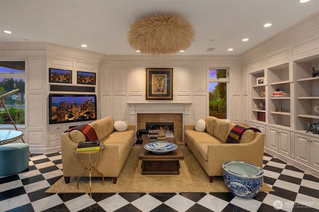 a living room with furniture and a fireplace
