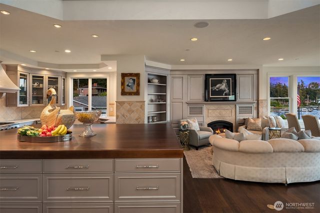 a living room with furniture fireplace and flat screen tv