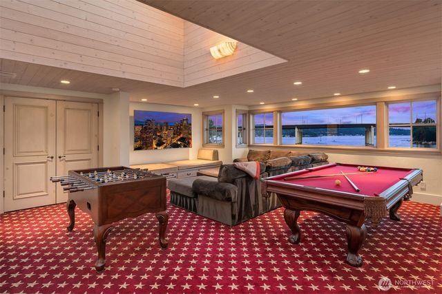 a room with furniture a table and a flat screen tv