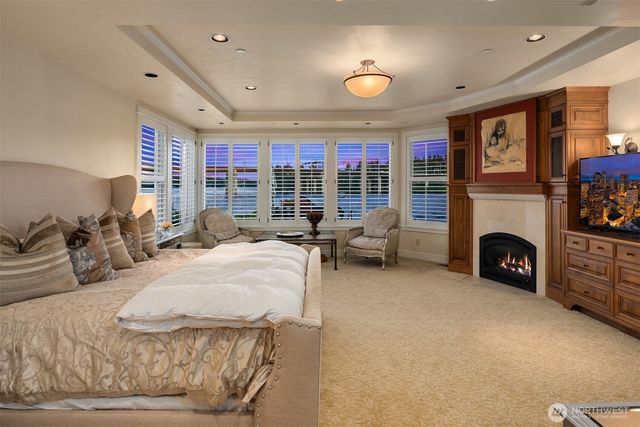 a bed room with a bed and a fireplace