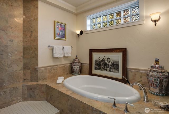 a bathroom with a sink a mirror and a bathtub