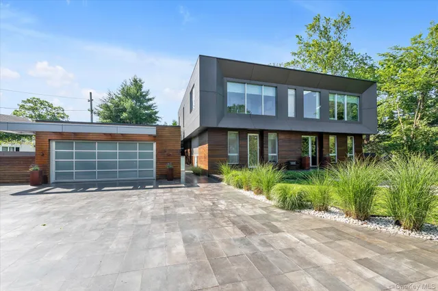 an aerial view of a house with garden space and street view