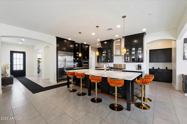 a outdoor space with chairs a large window and a counter top space