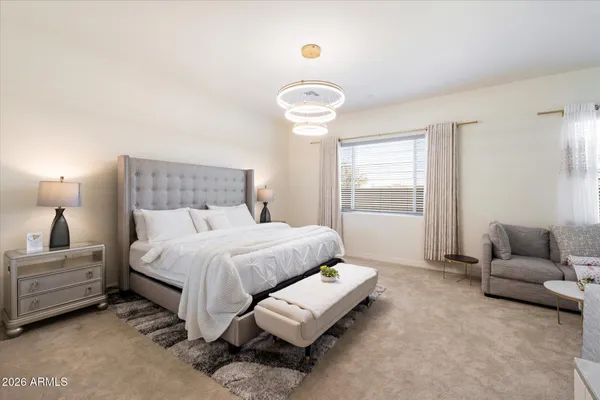 a bedroom with a bed and a couch