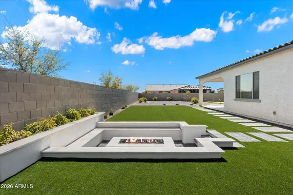 a view of a swimming pool with a yard
