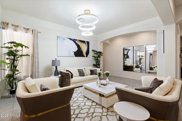 a living room with furniture and a large mirror