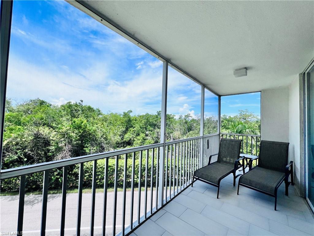 5 Bluebill Avenue, Unit 3031 Naples, FL 34108 - Photo 16 of 24 a view of a two chairs in the balcony