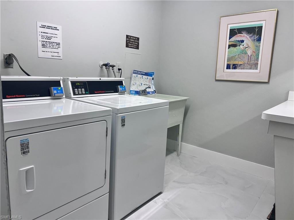 5 Bluebill Avenue, Unit 3031 Naples, FL 34108 - Photo 22 of 24 a utility room with dryer and washer