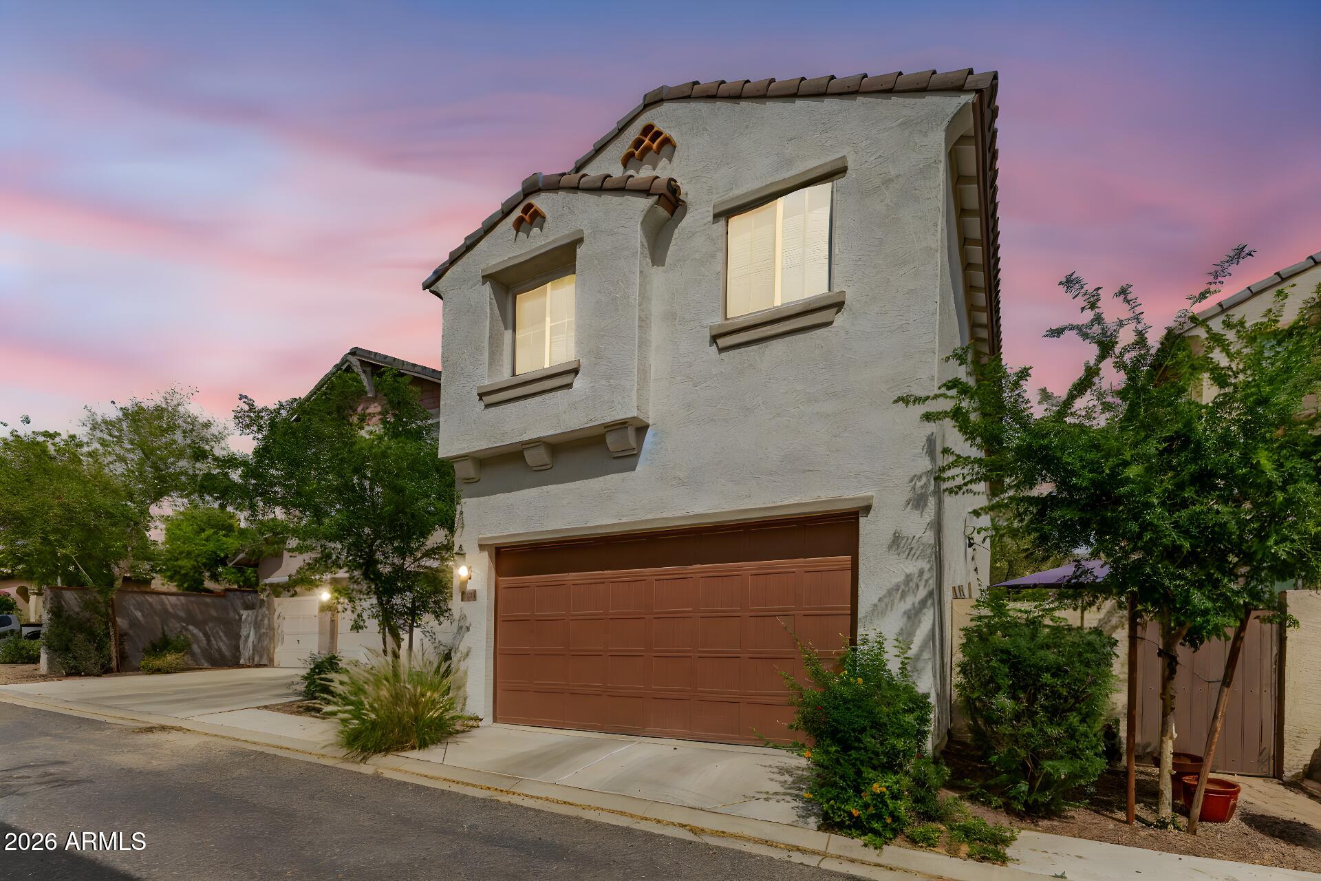 20607 West White Rock Road Buckeye, AZ 85396 - Photo 23 of 25 TWILIGHT - BACK OF HOME - GARAGE