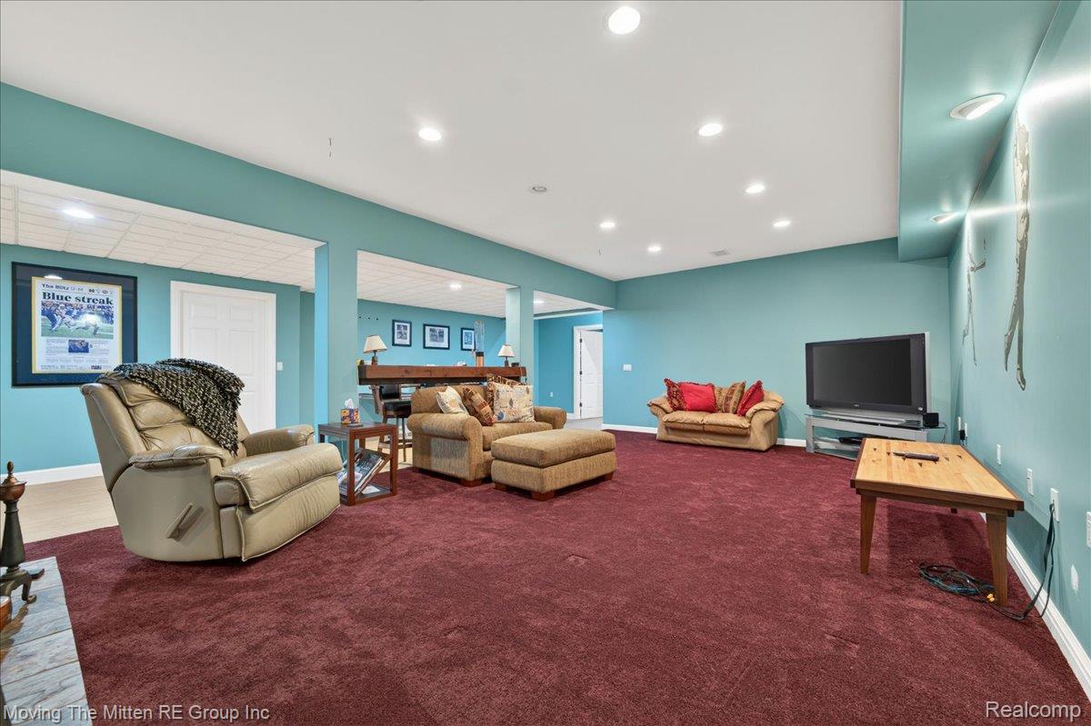 39750 Willow Road New Boston, MI 48164 - Photo 33 of 68 Spacious recreation room featuring recessed lighting, a built-in wet bar with overhead lighting, a drop ceiling, and a large carpeted area