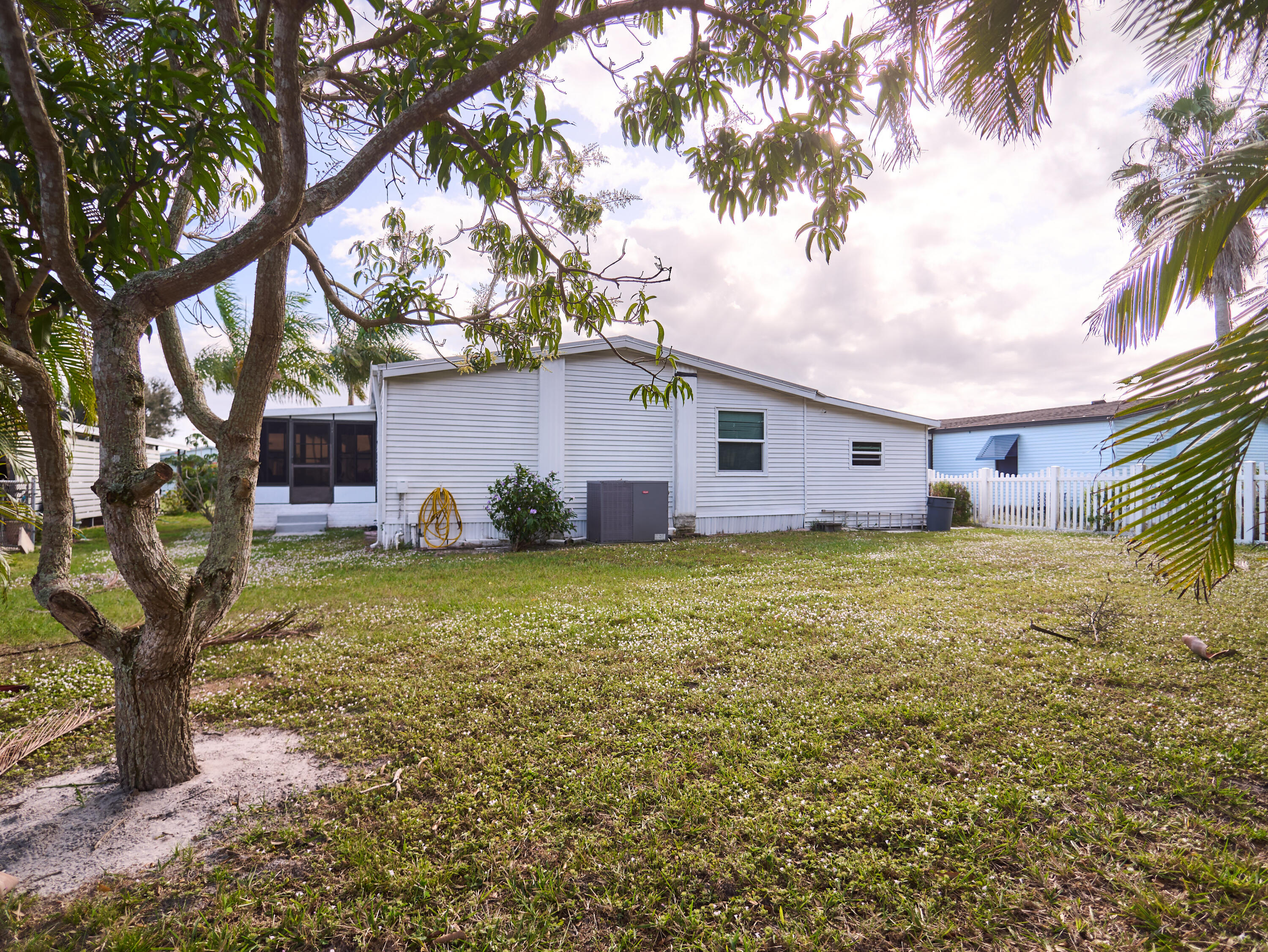 2779 Southwest Olds Place Stuart, FL 34997 - Photo 18 of 41 a view of a house with a yard
