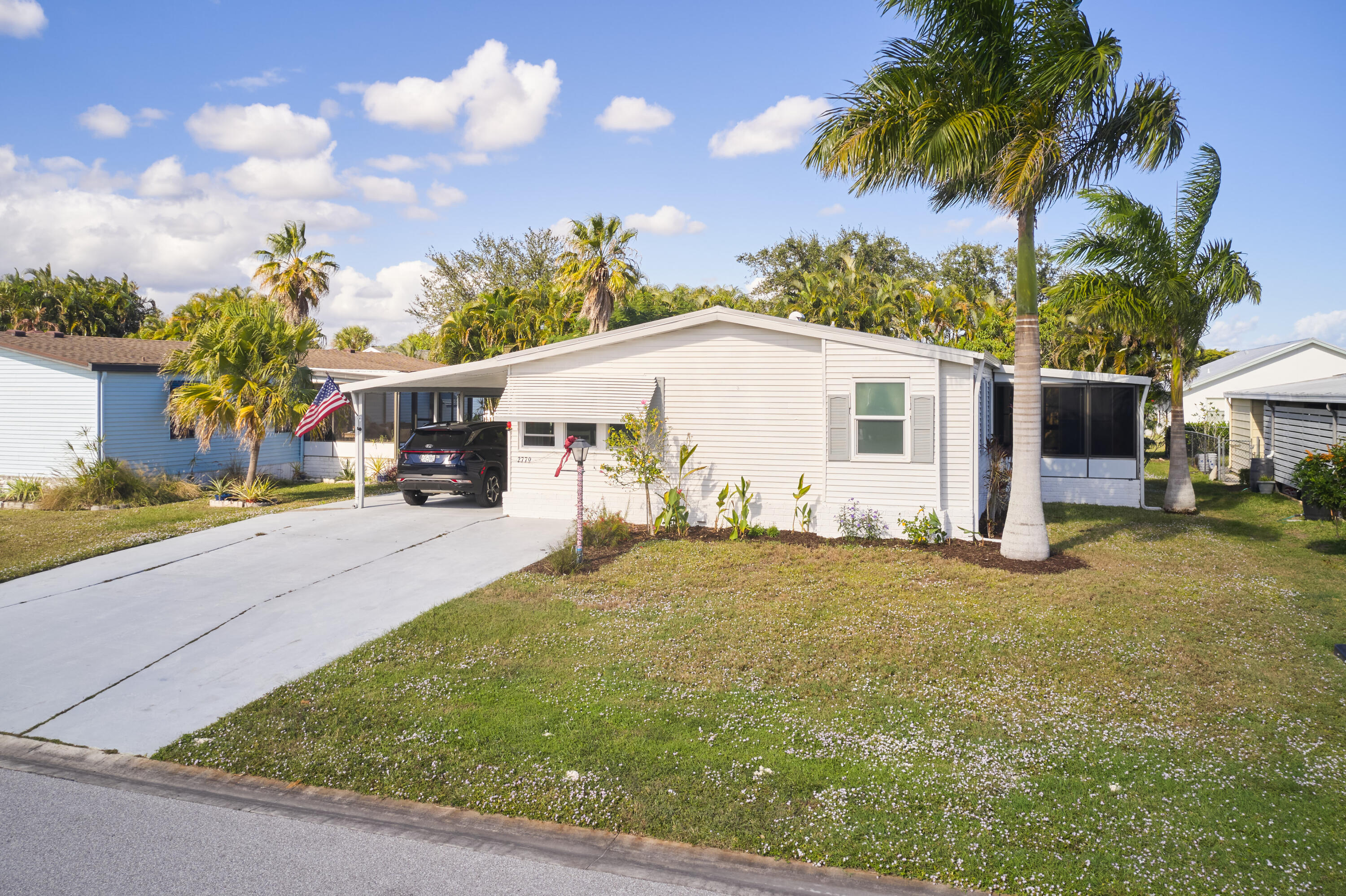 2779 Southwest Olds Place Stuart, FL 34997 - Photo 20 of 41 a view of a house with backyard and sitting area