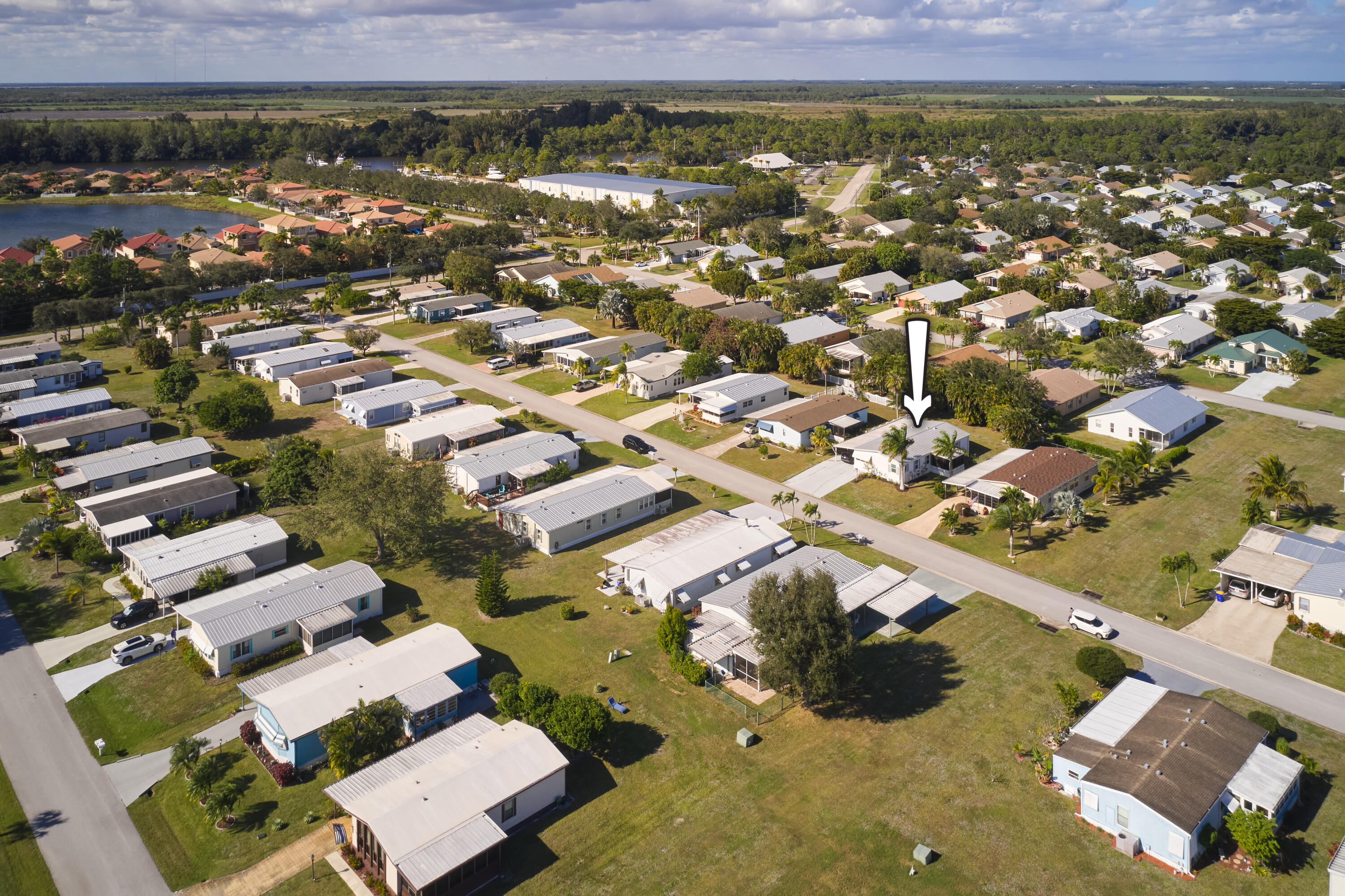 2779 Southwest Olds Place Stuart, FL 34997 - Photo 2 of 41 an aerial view of residential houses with outdoor space