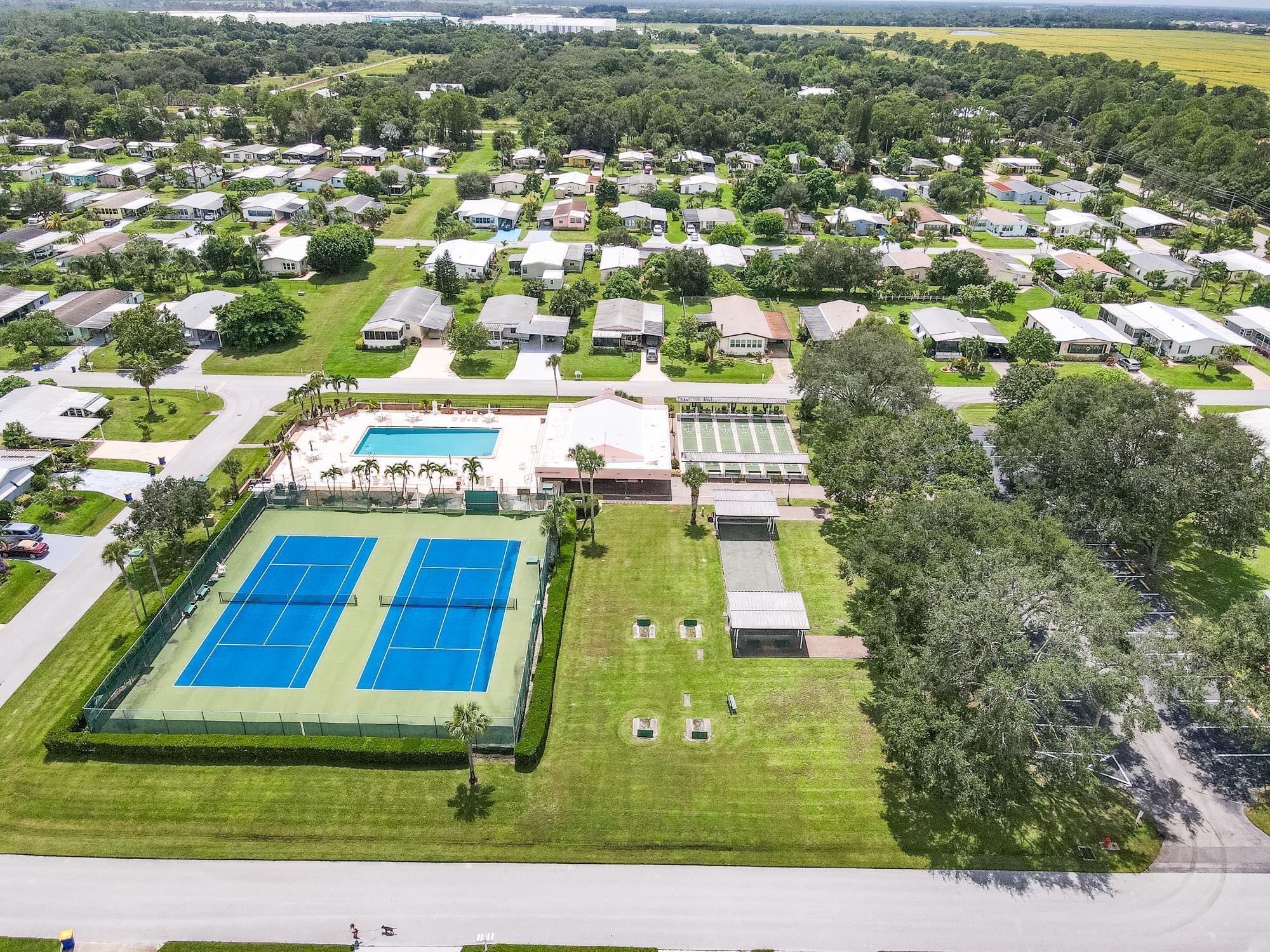 2779 Southwest Olds Place Stuart, FL 34997 - Photo 37 of 41 an aerial view of residential houses with yard