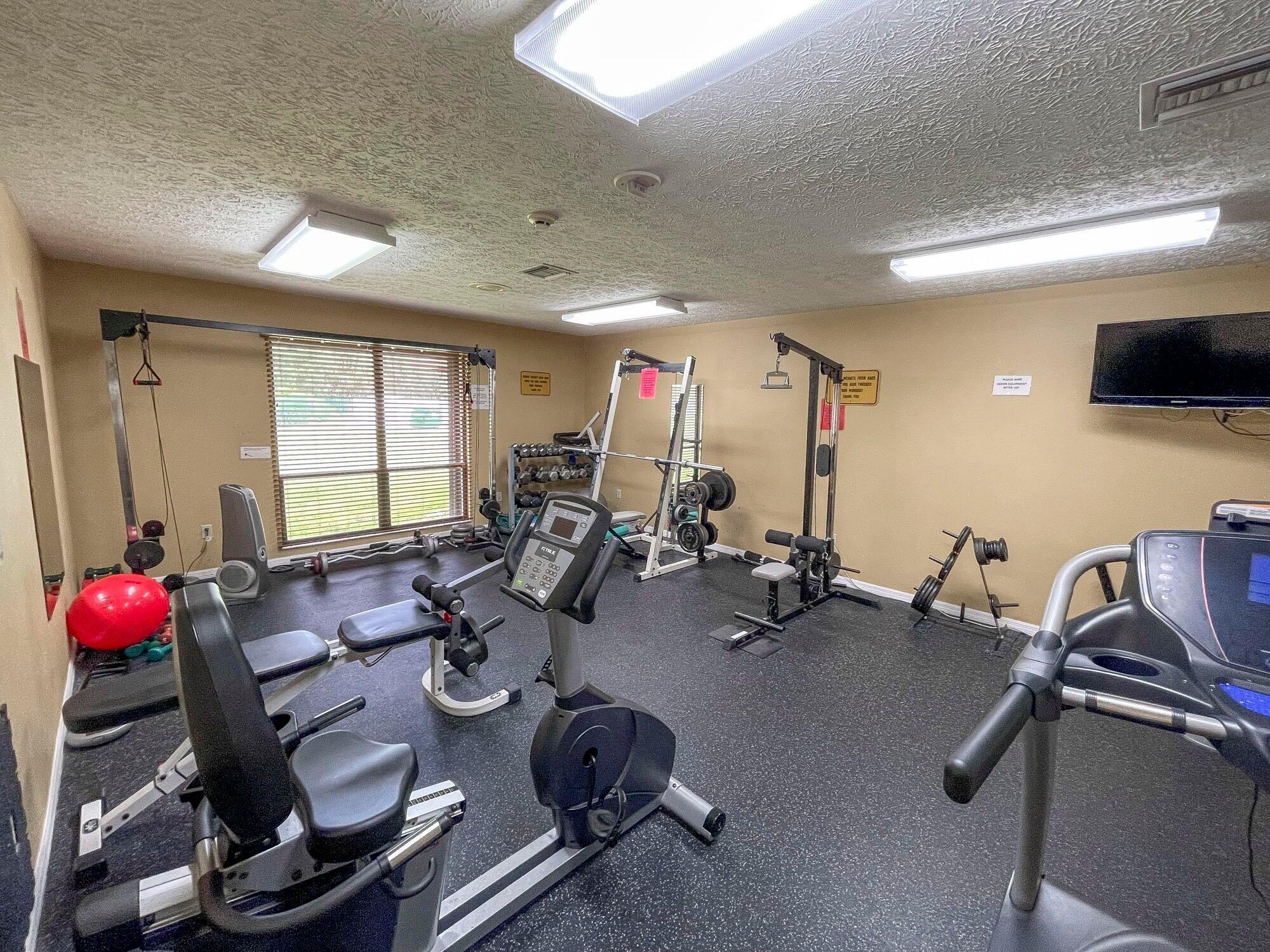 2779 Southwest Olds Place Stuart, FL 34997 - Photo 39 of 41 a room with gym equipment and a window