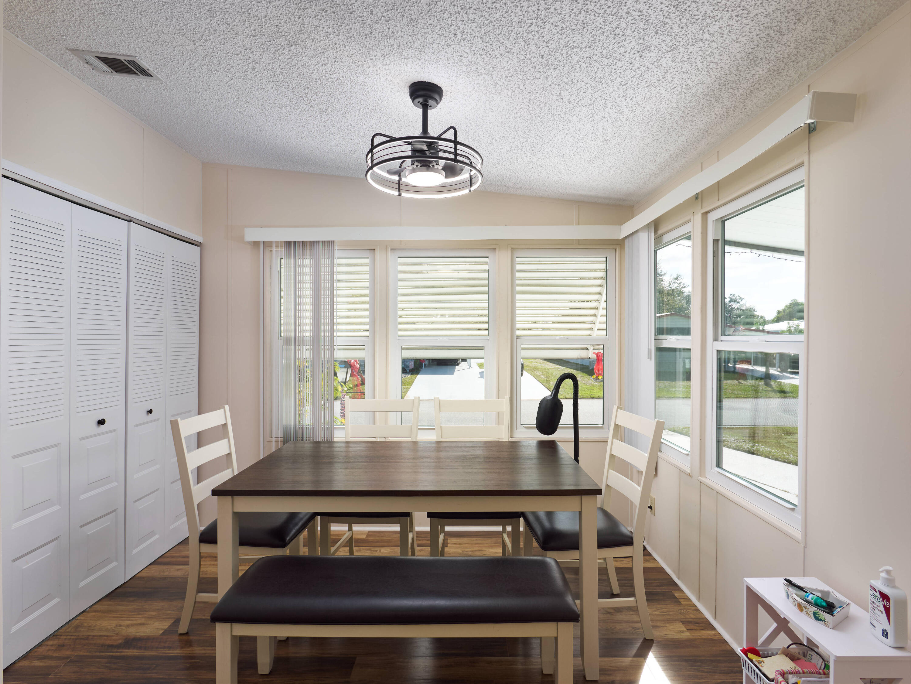 2779 Southwest Olds Place Stuart, FL 34997 - Photo 7 of 41 a view of a dining room with furniture wooden floor and a chandelier
